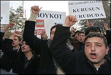 Young supporters of Islamic Felicity Party shout slogans in front of the Danish Embassy in Ankara, Wednesday, Feb. 1, 2006, to protest caricatures of the Prophet Muhammad published by a Danish newspaper, sparking outrage in Muslim countries, Protesters asked people to boycott Danish goods.(AP Photo/Burhan Ozbilici)