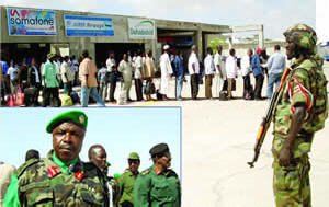 A UPDF soldier guards Somalis waiting to fly out of Mogadishu airport. Inset is the commander of the AU peace mission, Maj. Gen. Levi Karuhanga