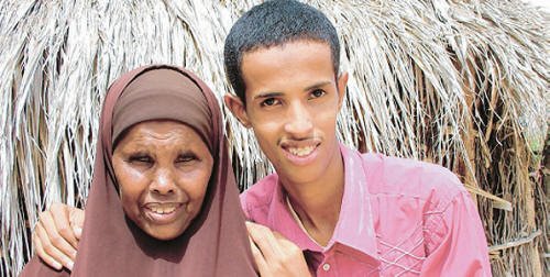 Abdi Ahmed Mohammed, the top boy in the 2008 KCPE exams in North Eastern Province with 434 points out of a possible 500. He is with his grandmother Khadija Omar Hassan, who encouraged his parents to take him to school. Photo/BASKASH JUGSODAAY